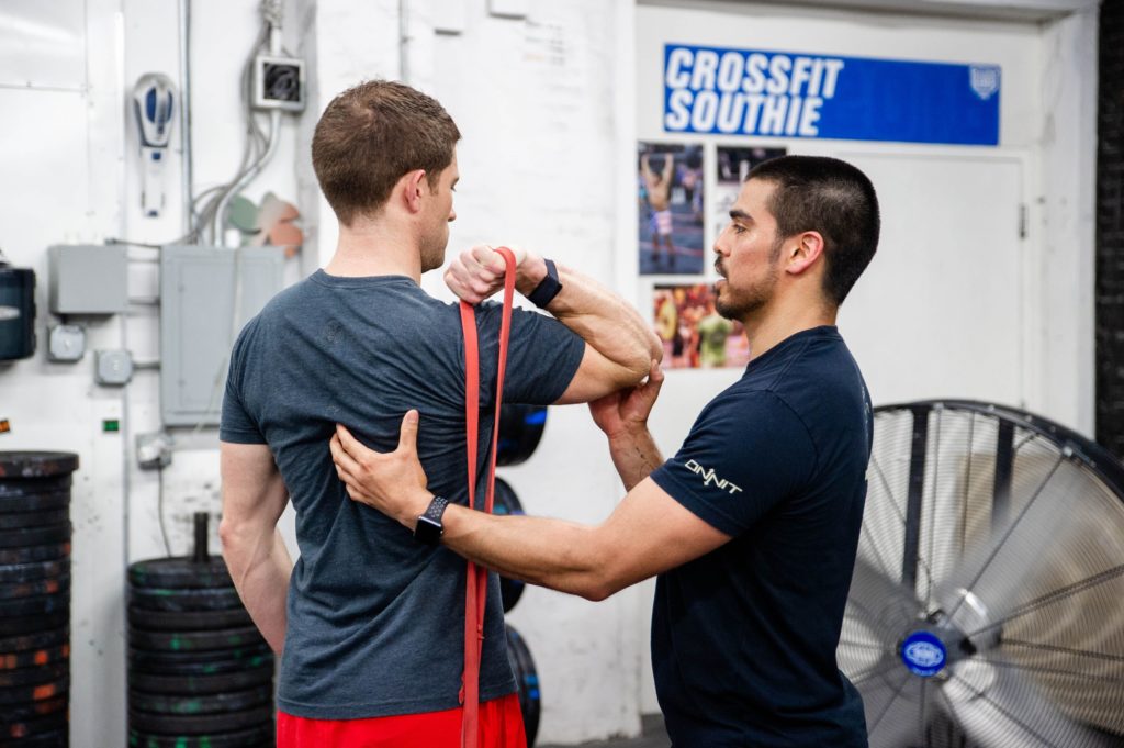 our instructor helping a client during a mobility session